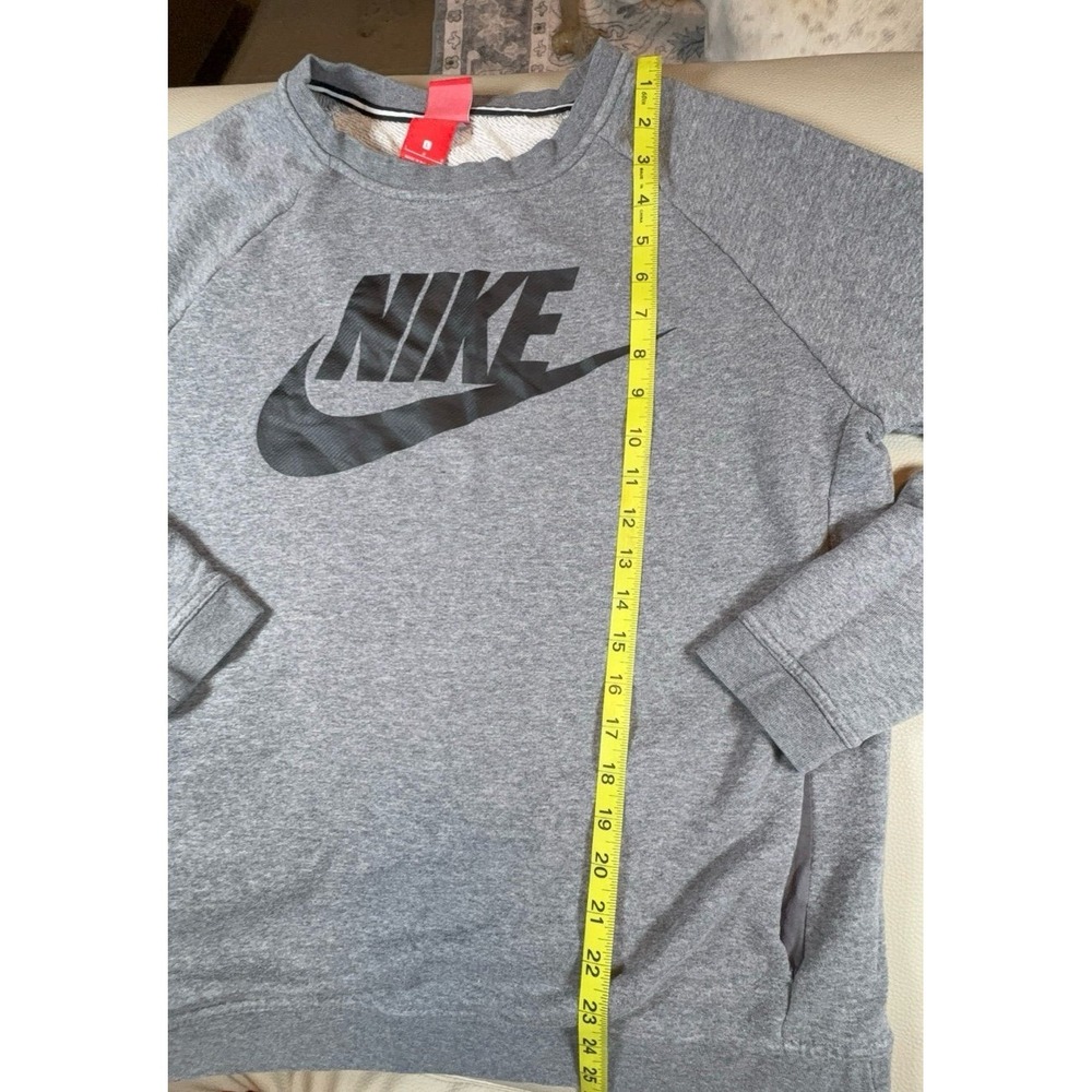 Men's or women's size large NIKE gray crew neck with pockets sweatshirt.